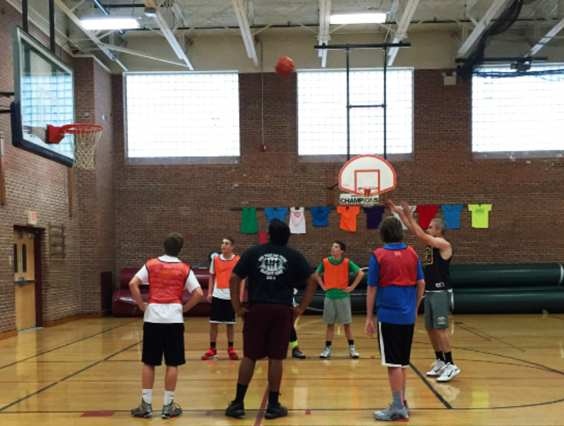 Nothing but net-- Physical Education teacher Christopher Machol shoots a pair of free throws to lead his team to victory. It was a very competitive, close game for majority of the game until the Buffalo Silverbacks went in full stride to capture a convincing win.
