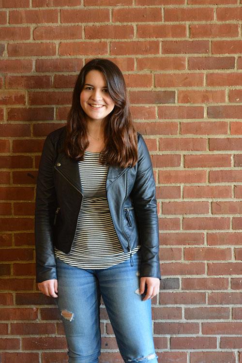 Loving the leather-- Senior Issy Vertefeuille dresses in a leather jacket, striped shirt and denim jeans. Denim is one style making an appearance this spring.