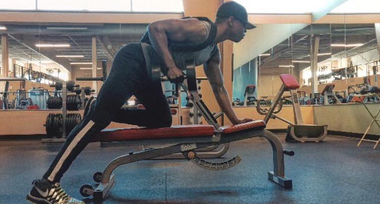 Lifting up-- Andrew Jones lifts weights at the gym in December of 2015. Jones pushes himself physically after being diagnosed with cardiomyopathy, a rare heart condition.