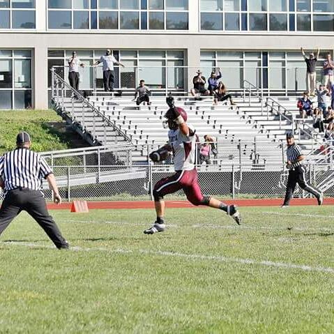 Senior Mike Popolizio scores a touchdown versus Hartford Public. 