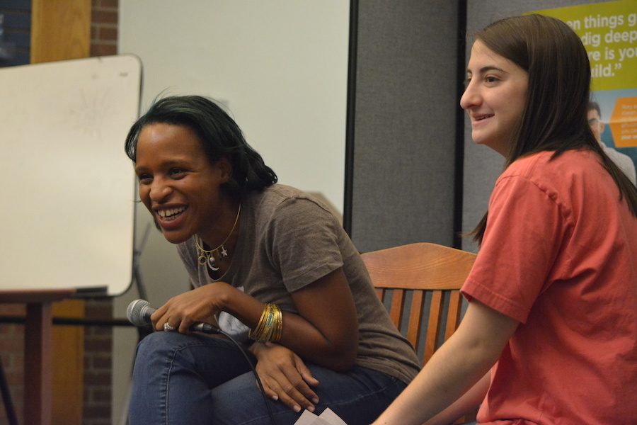 Bonding over books-- Young adult author Nicola Yoon answers questions by senior Alex Appel and audience members at her recent visit to the high school on December 1. Yoon discussed her newest novel, The Sun is Also a Star, a story about a two dissimilar teens who fall in love in 12 hours.