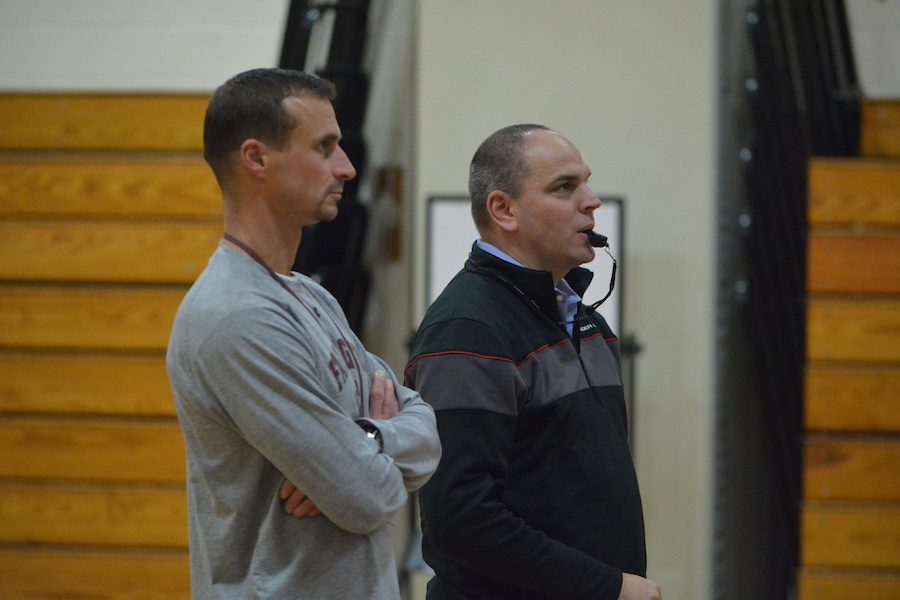 New Faces-- Freshman coach Jeff Manaresi (left) and new head coach Keith Garbart (right) prepare for their upcoming game. Garbart, former junior varsity coach, accepted the head coach position after Student Activities Director Russ Crist stepped down.