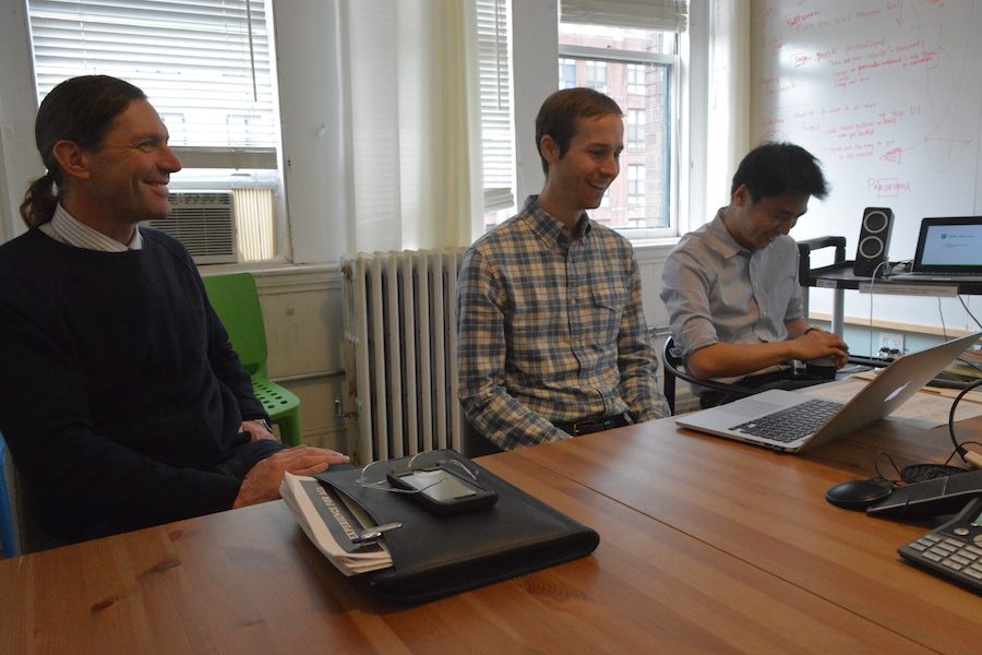 Working together-- Design team members Terrence Fradet and Roger Zhu present their process and methods associated with working on with other departments within the company Panorama. This meeting took place before high school students presented about student rounds. 