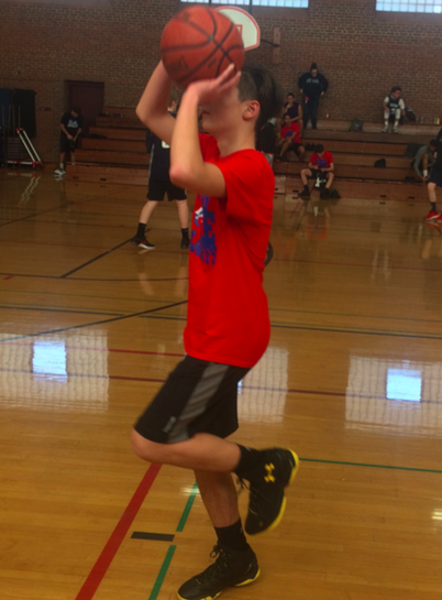 Shooting for the championship-- Junior and Los Angeles Clippers player Rollie Chamberlain shoots a cool down shot a er a match on February 4. IBA features 14 teams with captains from all four grades.