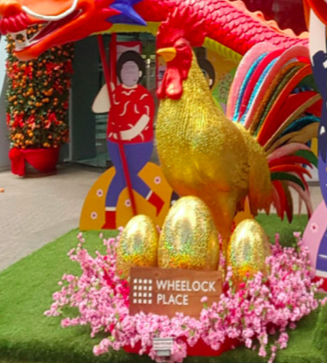 Rich Rooster-- A rooster with golden eggs is displayed on the eve of the lunar new year. Decorations celebrating the lunar new year adorned the Wheelock Place shopping mall in Singapore.