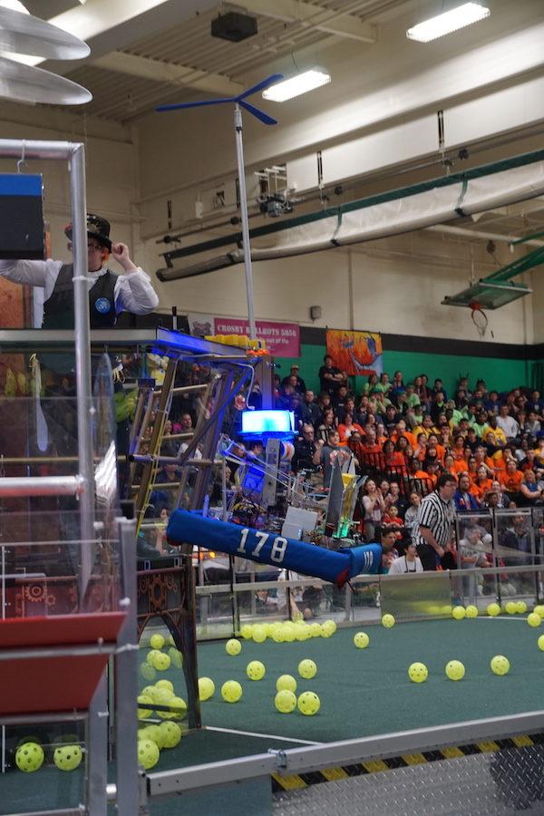 Ready for takeoff-- The Second Law Enforcer’s robot climbs the rope during the last 30 seconds of their match. Robots in this year’s game have the opportunity to earn up to 150 points per alliance team if they have the ability to climb. 