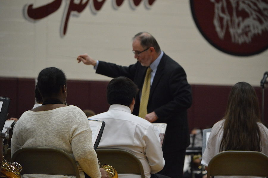 Conducting with confidence-- Band director Thomas Johnston leads the concert band during their performance on March 29. This year’s District Wide Music Festival featured the band program in grades sixth through twelve with concerts held on March 28 and 29.