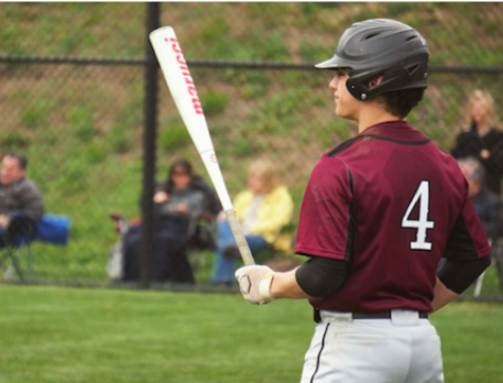  Batter Up-- Junior Pat Arnold prepares to bat in a game last year against Avon. The
 team held a 5-4 lead until the sixth inning where Avon took a strong lead, winning them the game 9-5.
