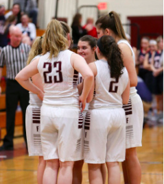 All In-- Seniors Erica Szydlik, Julia Borgida, Tara O’Coin, Amanda James and Mary Schoenherr prepare to start their final home game. The girls’ basketball team defeated Avon on Senior Night 58- 18 on February 13.
