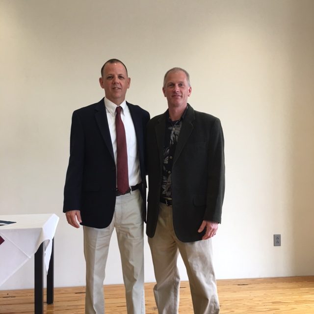 Dr. Darren Robert presents Practitioner award to ECSU alumni Edward Manfredi.