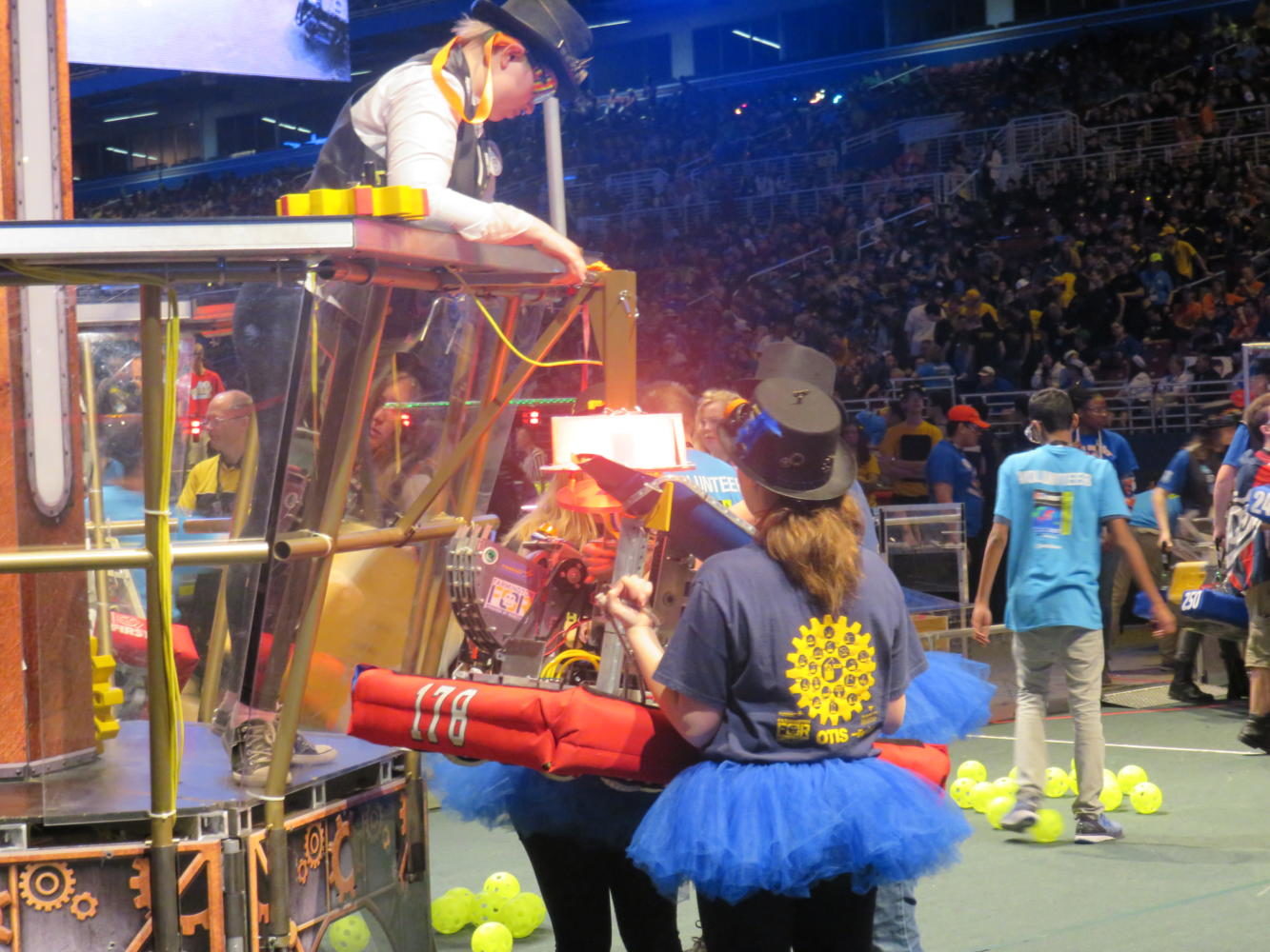 Zooming around -- Team 178, The Second Law Enforcers, robot, Gearzmo, hits a hopper dropping 100 balls onto the field which can be collected and shot inside of a low and high goal. The team ranked an overall 35 out of 68 with seven wins and three losses after the three day event.