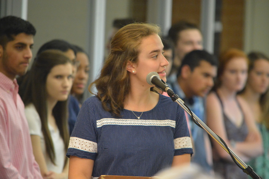 Natural leader-- Senior Math Honor Society (MHS) President Emma Sherrill presents during the MHS junior induction on May 18.  Sherrill was recently recognized as a Presidential Scholar semifinalist for her leadership both in and out of the school community.