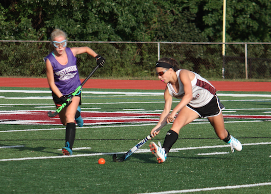 Fighting for the Win--Senior Leia Ficks prepares to pass to a teammate during the team’s fourth game against Westbrooke. Despite the effort, the field hockey team fell to Westbrooke in a 1-0 game. 
