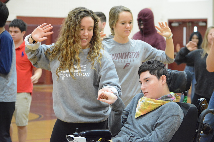 Dancing together-- Senior Amy Driscoll and Unified PE partner Gabby Salas practice for the Dance of Kindness, which will be performed by students, faculty, and staff at the pep rally on October 27. The Dance of Kindness is a worldwide event hosted by Life Vest Inside and will take place globally on November 13.