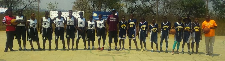 Girls united-- Girls from a village in Africa wear basketball jerseys donated by local Connecticut high schools. Farmington and Glastonbury are two of the many schools that donated old jerseys and basketball shoes for the
girls in Africa.