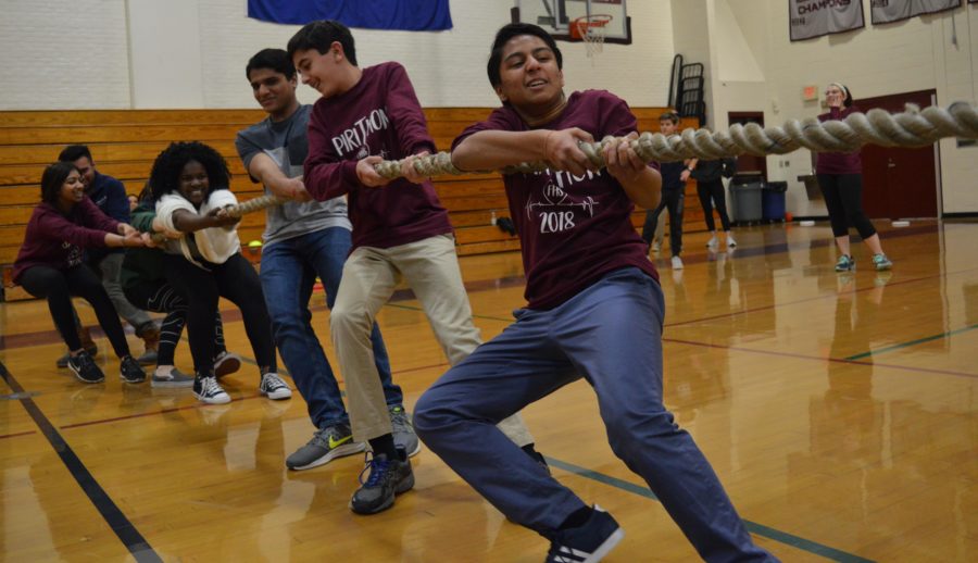 Friendly competition-- (from right to left) Sophomore Sia Goel, freshman Bryce Adib, freshman Shaan Mangla, junior Chantelle Otu-Appiah, and sophomore Harshita Kumar participate in a tug of war match during SpiriThon. Other activities included video games, a trivia contest, and dodgeball. The event raised over $5200.