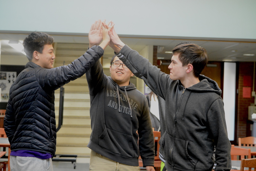 1,2,3 victory-- Juniors Ethan Grubelich, Huaxuan Chen, Brian Peng, and Nate Landry, celebrate their win on March 22 at the Trivia Night hosted by the World Awareness Programme club. Participants answered an overall 25 questions about various topics ranging from sports, history, geography and general information.