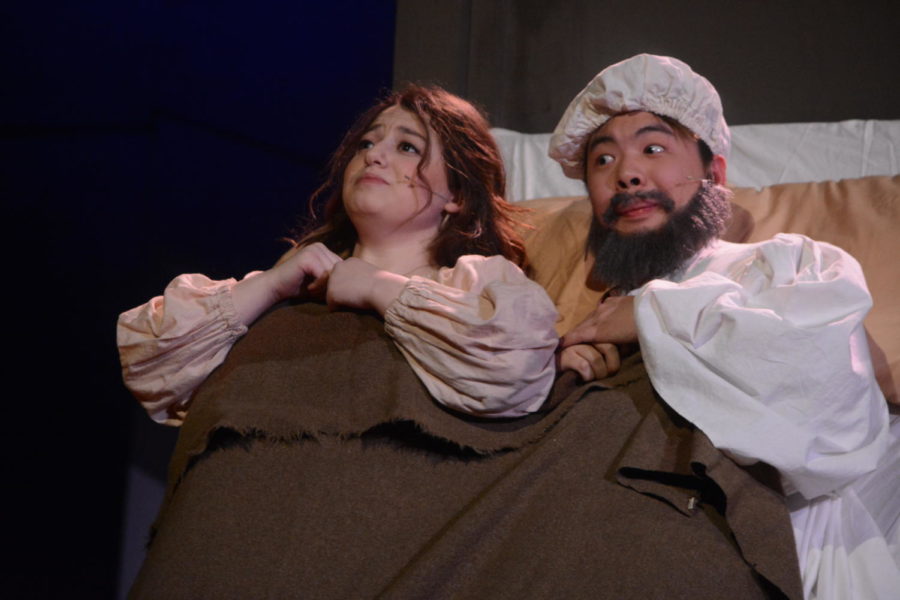 A change of heart-- In a humorous scene from the Drama Department’s production of Fiddler on the Roof, Golde, played by senior Rebekah Moses (right), decides that her daughter should marry the town tailor, Motel, to the secret elation of Tevye (left), played by junior Tristan Wong. The cast performed on March 8, 9, and 10 after missing dress rehearsals due to snow.