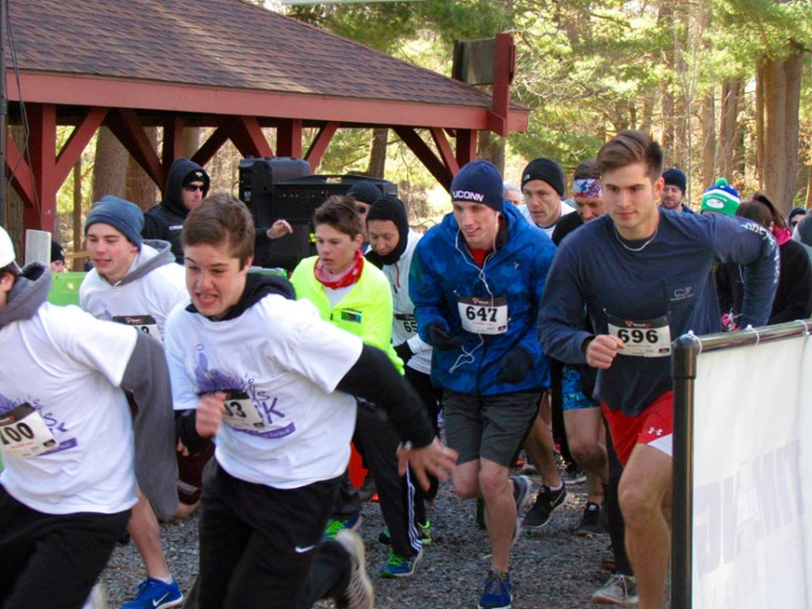 Helping hands-- Participants in the Amy’s Angel’s 5K run at Winding Trails race towards the finish line. This is the third year the high school has been involved with this organization started by senior class president Jocelyn Bohlman.
