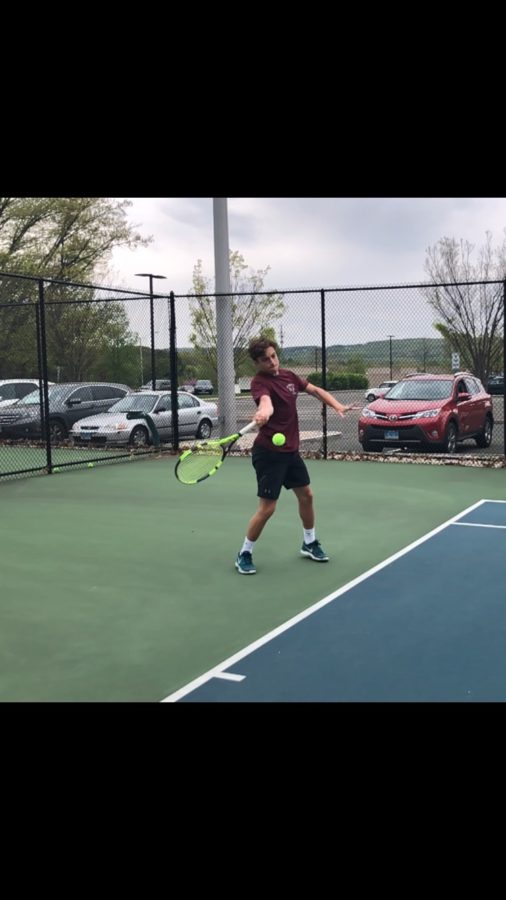 Serve’s up-- Senior Kam Moderessi returns a serve from teammate
senior Blake Rutenberg in practice. The tennis team is 11-2 as of May 21
and fourth in Class L.