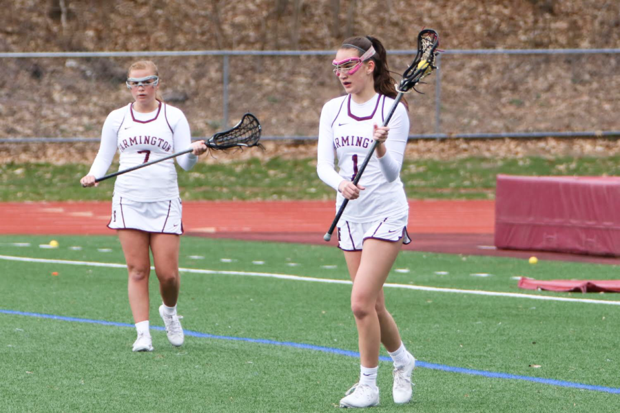 Passing+the+torch--+Freshmen+Sarah+Catillo+receives+the+ball+from+senior+Ali+Sheehy.+Sheehy+has+been+a+varsity+starter+all+four+years+of+high+school%2C+and+Catillo+is+a+first-year+varsity+player.