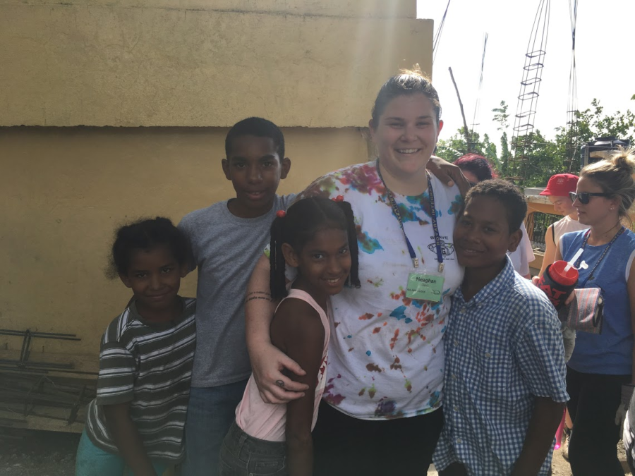 A helping hand -- The founder and chief executive officer (CEO) of BRAVE, Meaghan Davis helping build a school with Noemi and other mem-
bers of the community. This picture was taken the summer of 2017 when the BRAVE organization traveled to the Dominican Republic.