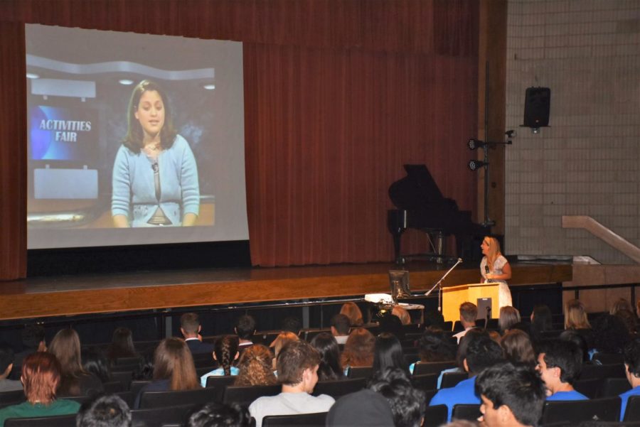 Humble Beginnings-- High school alumna and executive producer for social and emerging media at CNN Worldwide Ashley Codianni watches a clip of herself from her time anchoring the 9:05 News. Senior Convocation took place September 7. 
