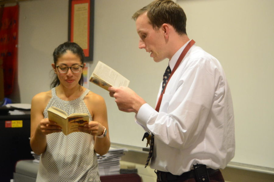 It takes two-- English teacher MJ Martinez (left) and social studies teacher Patrick Mulcahy (right) read The Adventures of Huckleberry Finn by Mark Twain together as part of third unit of the new American Studies Honors course. The course runs twice a day for two periods and fulfills both the English and United States History requirements for juniors. 