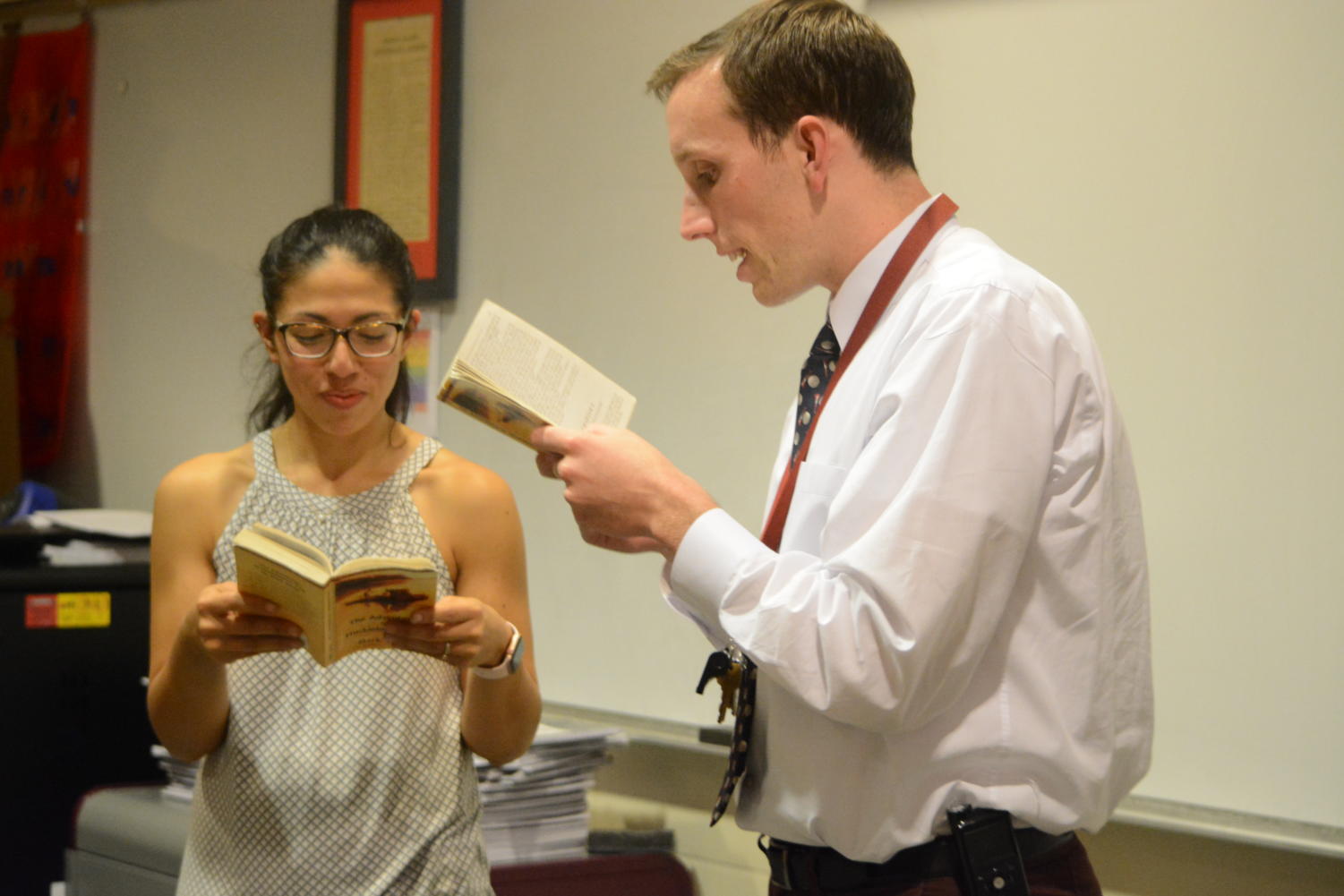 It takes two-- English teacher MJ Martinez (left) and social studies teacher Patrick Mulcahy (right) read The Adventures of Huckleberry Finn by Mark Twain together as part of third unit of the new American Studies Honors course. The course runs twice a day for two periods and fulfills both the English and United States History requirements for juniors.