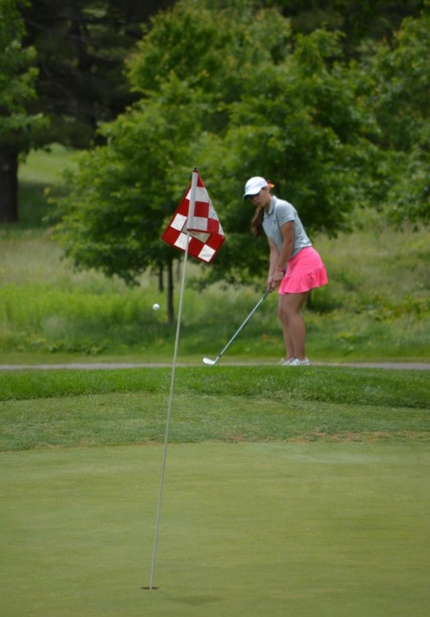 Tee up-- Senior Mia Grzywinski watches as the golf ball sails toward the hole. Gryzwinski has commited
to play for Quinnipiac Univeristy’s Division I golf program.