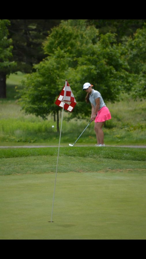 Tee up-- Senior Mia Grzywinski watches as the golf ball sails toward the hole. Gryzwinski has commited
to play for Quinnipiac Univeristy’s Division I golf program.