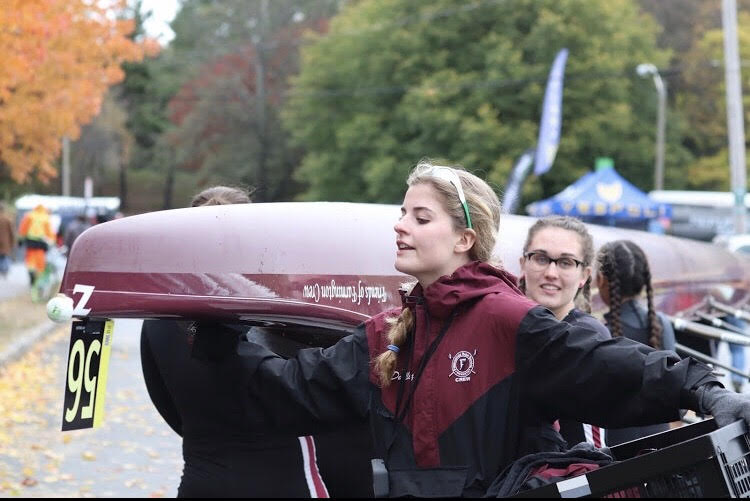 Going to the race-- The girls crew team transports a boat. The Head of the Charles Regatta took place on Friday, October 19. 