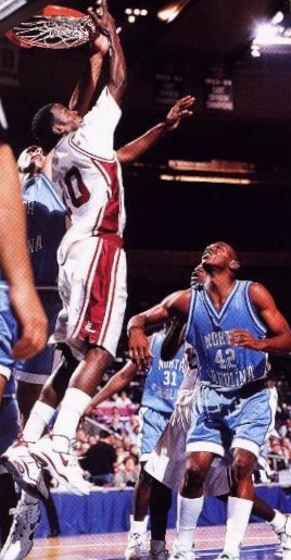 Rise Up-- University of Massachusetts (UMass) guard Mike Williams (10) puts in the reverse lay-up against the University of North Carolina (UNC) in the semifinals of the National Invitational Tournament on November 24,1993. Williams lead UMass to a 91-86 overtime upset of number one ranked UNC.