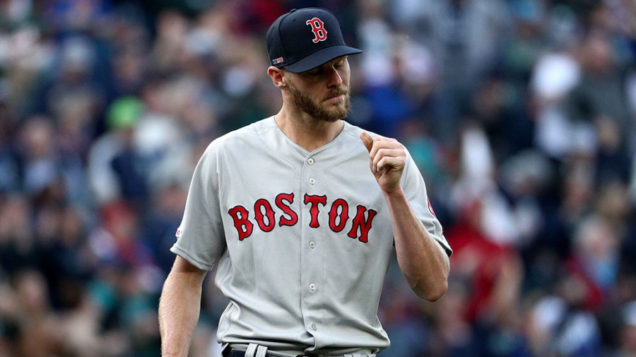 SEATTLE, WA - MARCH 28: Chris Sale #41 of the Boston Red Sox reacts after giving up a solo home run to Edwin Encarnacion #10 of the Seattle Mariners in the third inning during their Opening Day game at T-Mobile Park on March 28, 2019 in Seattle, Washington.