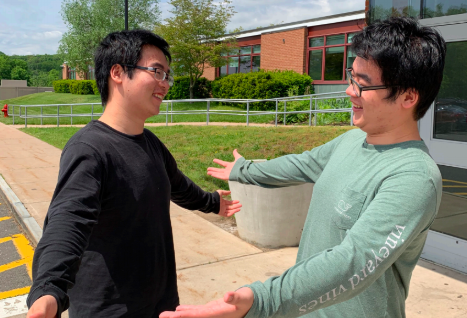 Best friends-- Seniors Pei Chao (left) and Pei Yi (right) Zhuo celebrate their achievements on Derby Day at the high school on
May 23. The two will be separating for the first time since they were born when they go to Harvard University and Duke University,
respectively.