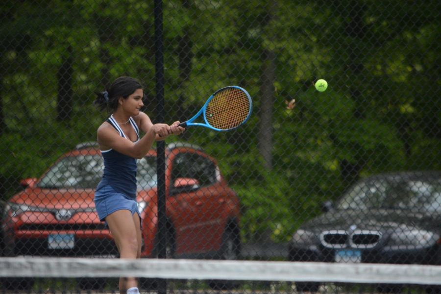 Making a racket-- Freshman Sonali Patel returns a serve during a practice in preparation for states. The team had a first round bye after coming off of a 14-1 regular season. 