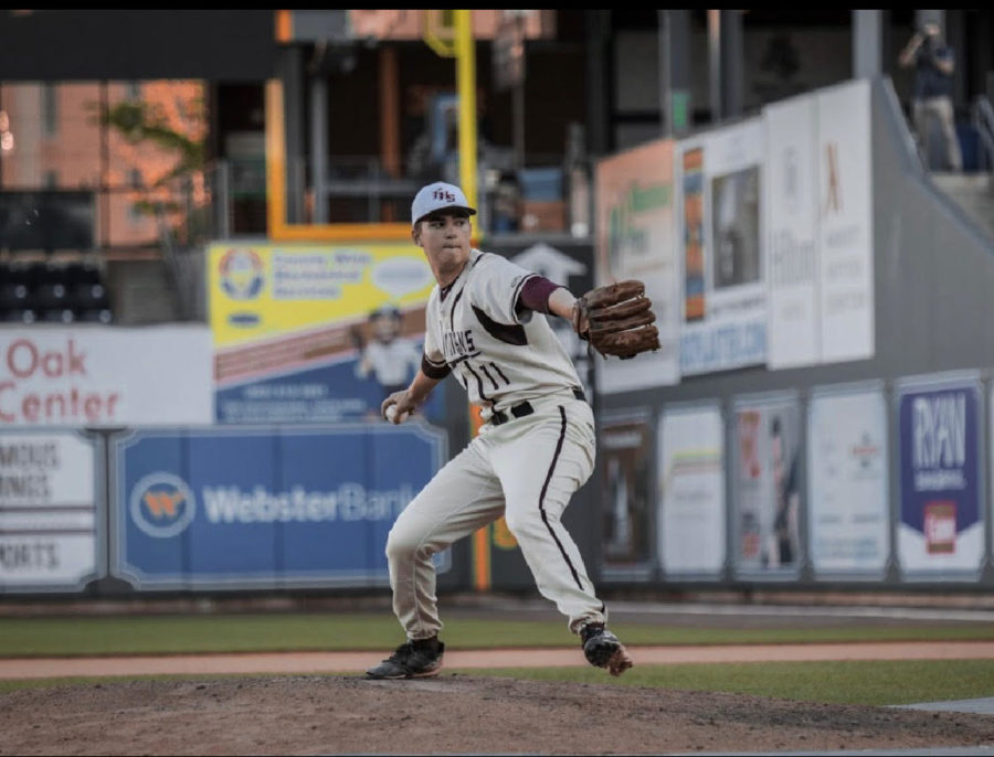 Committed-- Senior Tyler Cortland fires a pitch against Northwest Catholic on May 8 at Dunkin Donuts Park. Cortland will attend Dartmouth College in the fall. 
