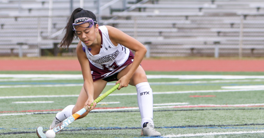 Shot and a score-- Senior Karen Ru swipes with her field hockey stick across the field for the score. The team had a successful regular season and are excited for the future.
