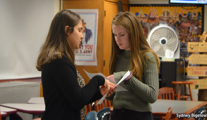 Privilege walk workers-- Sophomores Olivia Heckman (right) and Rachel Wolkoff (left) collaborate before
their privilege walk on December 6. The walk was hosted a part of the empowerment project in order to raise
awareness of American privilege. 