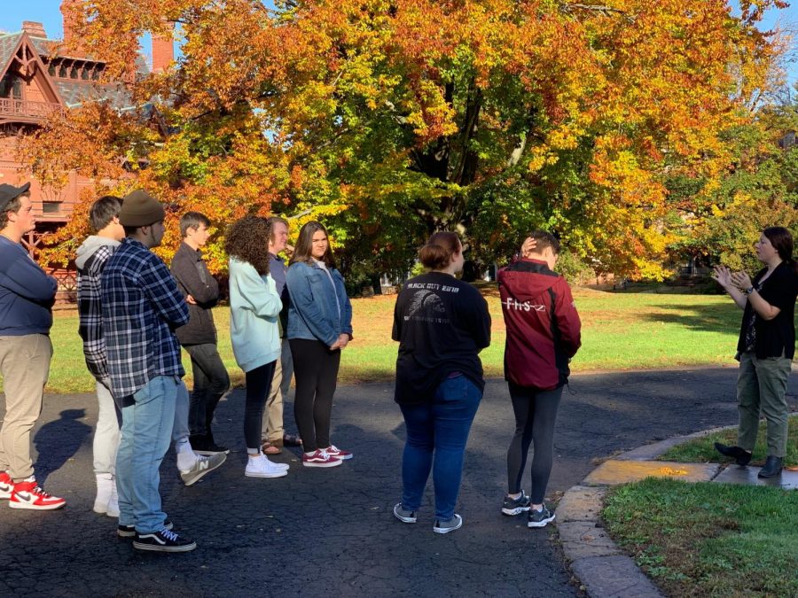 A blast from the past-- (right to left) Juniors Max Alvarez, Cade Gonzalez, Nick Campagnano, Gavin Parish, Olivia Espinosa, Cullen Laberge, Abby Belisle, Sam Kilduff,
and Maggie Siemiatkaska stand outside the Harriet Beecher Stowe Center with their tour guide. The American Studies students visited both the Mark Twain House and
Harriet Beecher Stowe Center as part of their second unit of study.