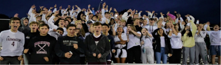 Cheering loud and proud-- The Farmington High School student section also known as The Tribe, cheer for the boys soccer team in their opening night matchup against Plainville Highschool. The Tribe has a long history at
FHS, and brings the spirit to athletics.