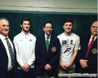 Proud Players-- Seniors Michael Gregory (left) and Jacob Conrad (right) are awarded the Scholar-Athlete award by representatives of the National
Football Foundation and the Connecticut Football Hall of Fame. This is the first time in school history that two students have won the award in the
same year