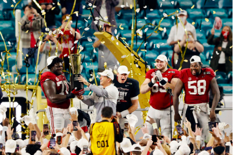 Best of the Best -- Alabama senior Alex Leatherwood and head coach Nick Saban lift the College Football Playoff National Championship trophy, after completing a 52-24 victory
over Ohio State on January 11. The triumph marks Alabama’s third victory in the last five years and eighteenth of all time. 