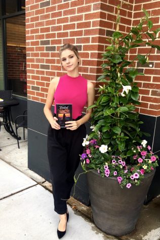 Published and proud -- Author Khrystyna Stets poses with a copy of her novel, Faded Reality. Stets is a senior
enrolled in the custom capstone.