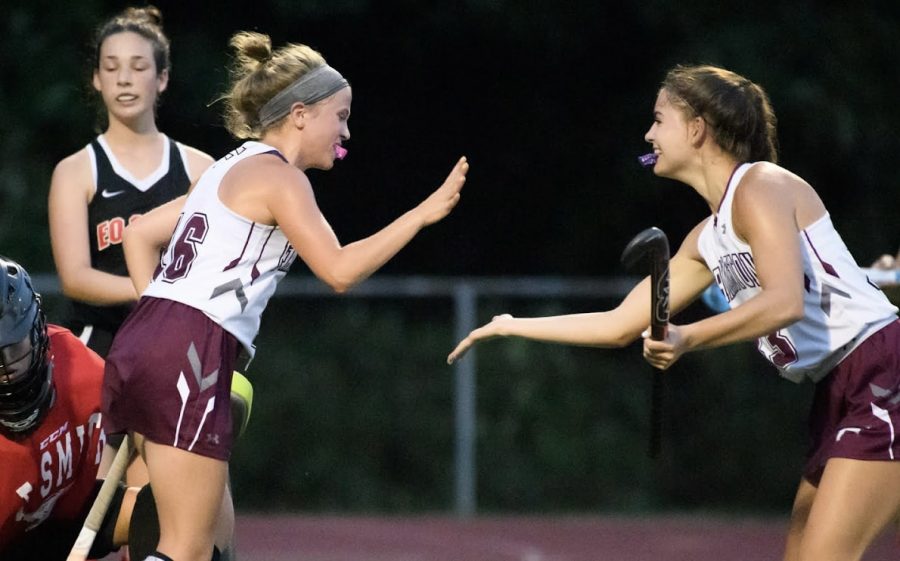 Give me five — Senior Delaney Dopp (left) reaches to high-five sophomore Anna Loughman (right) after scoring one of five goals for the River Hawks against E.O. Smith. The team stands at 4 wins and 0 losses. 