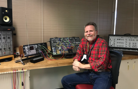 Lights, camera, action--  Evan Foreman sits in ‘The Edge’, the main room used for filming the 9:05 News. At the end of September, Foreman stepped down as the director of Audio Visual programs. 