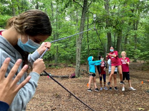 Bonding on the ropes -- The Freshman council walks on wires in teams of two, cheering each other on as they go. Student councils went on a field trip in September. 