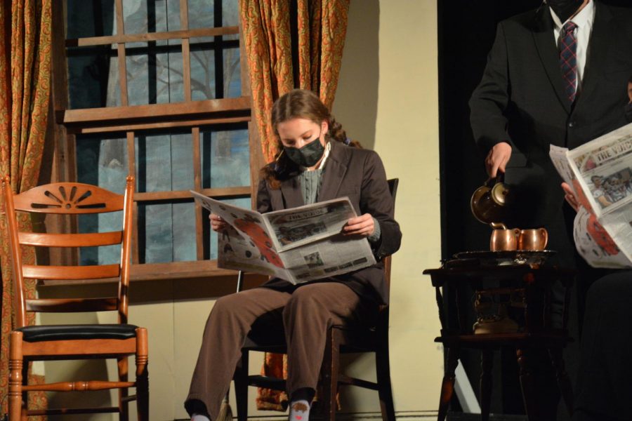 Light reading — Senior Olivia Rose holds up the latest issue of The Voice as a prop during the play. Rose acted in Gorgeous and The Potman Spoke Sooth. 