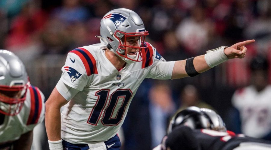 Rookie+rising+to+the+top+--+Patriots+quarterback+Mac+Jones+directs+the+team+during+their+25+-+0+win+against+the+Atlanta+Falcons+on+November+18.+The+New+England+Patriots+are+the+number+one+seed+in+the+AFC.+
