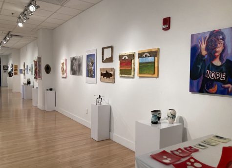 Calling all artists -- Artwork on display at Tunxis Community College attracts an
audience. The show began January 28 and continued through mid-February.